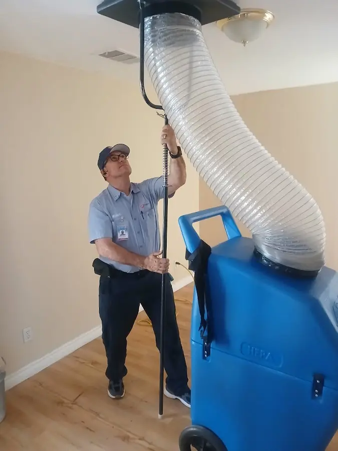 Furnace Tune-Up technician using HEPA equipment in Nolensville
